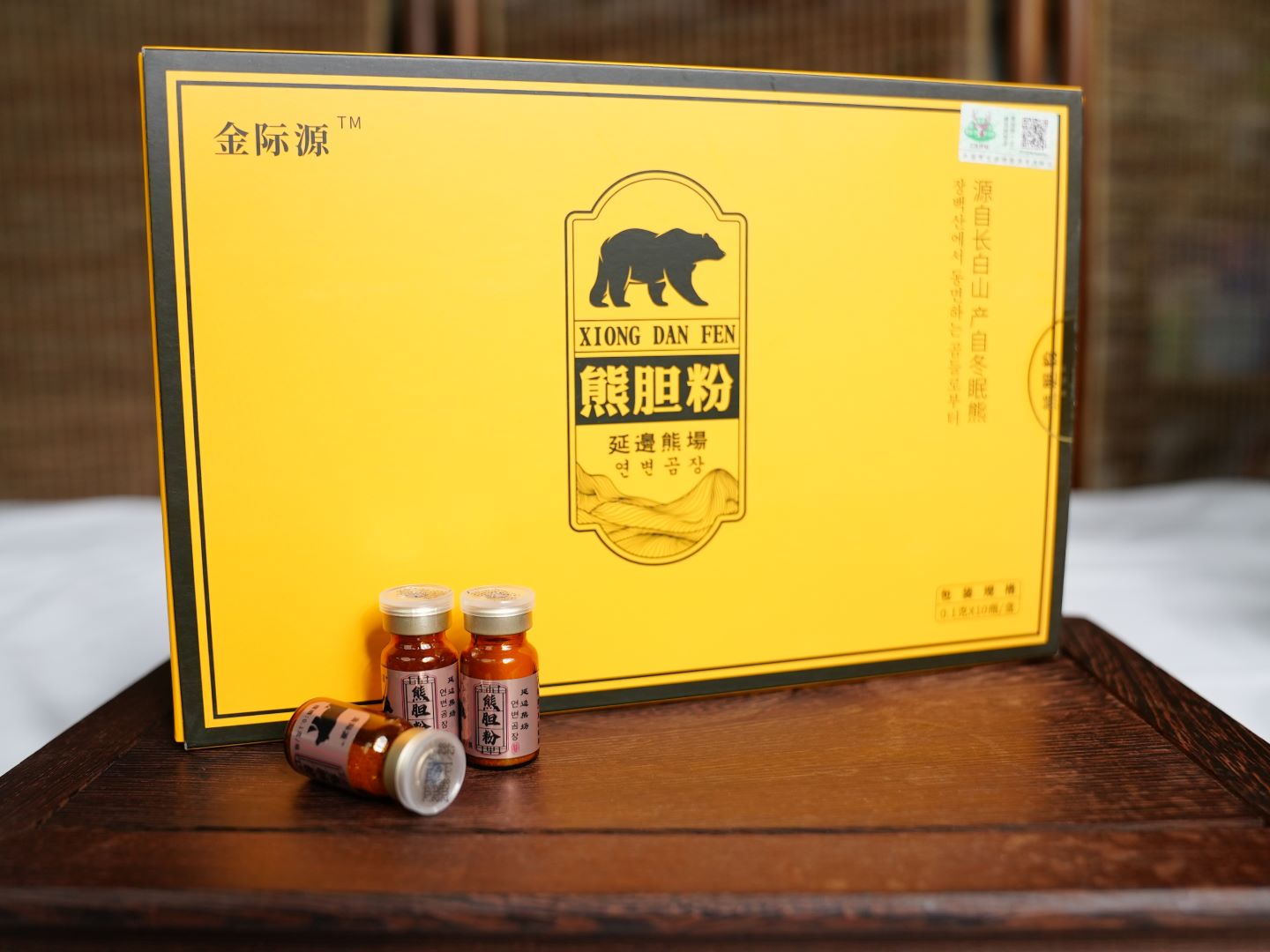 Two each of gray, white, and black shirts laying flat.